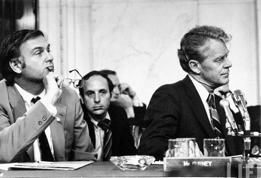 Edward J Gurney and his lawyer listen to arguments made by the prosecution in court.