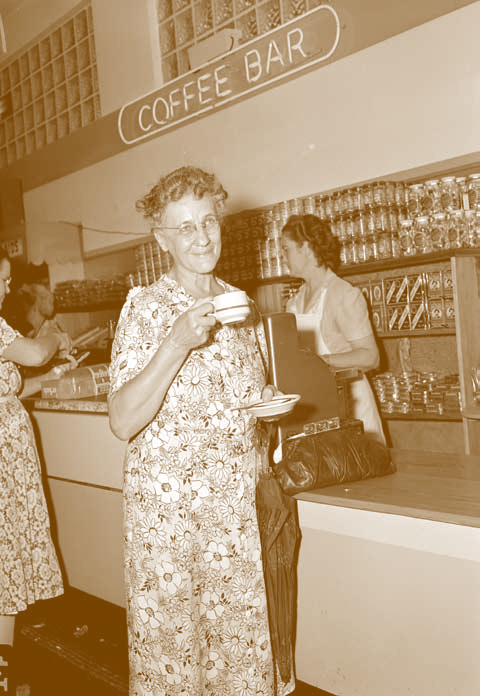 A Winn-Dixie customer enjoys a cup of freshly brewed coffee at the store's Coffee Bar.max-width:100%; max-height:100%;