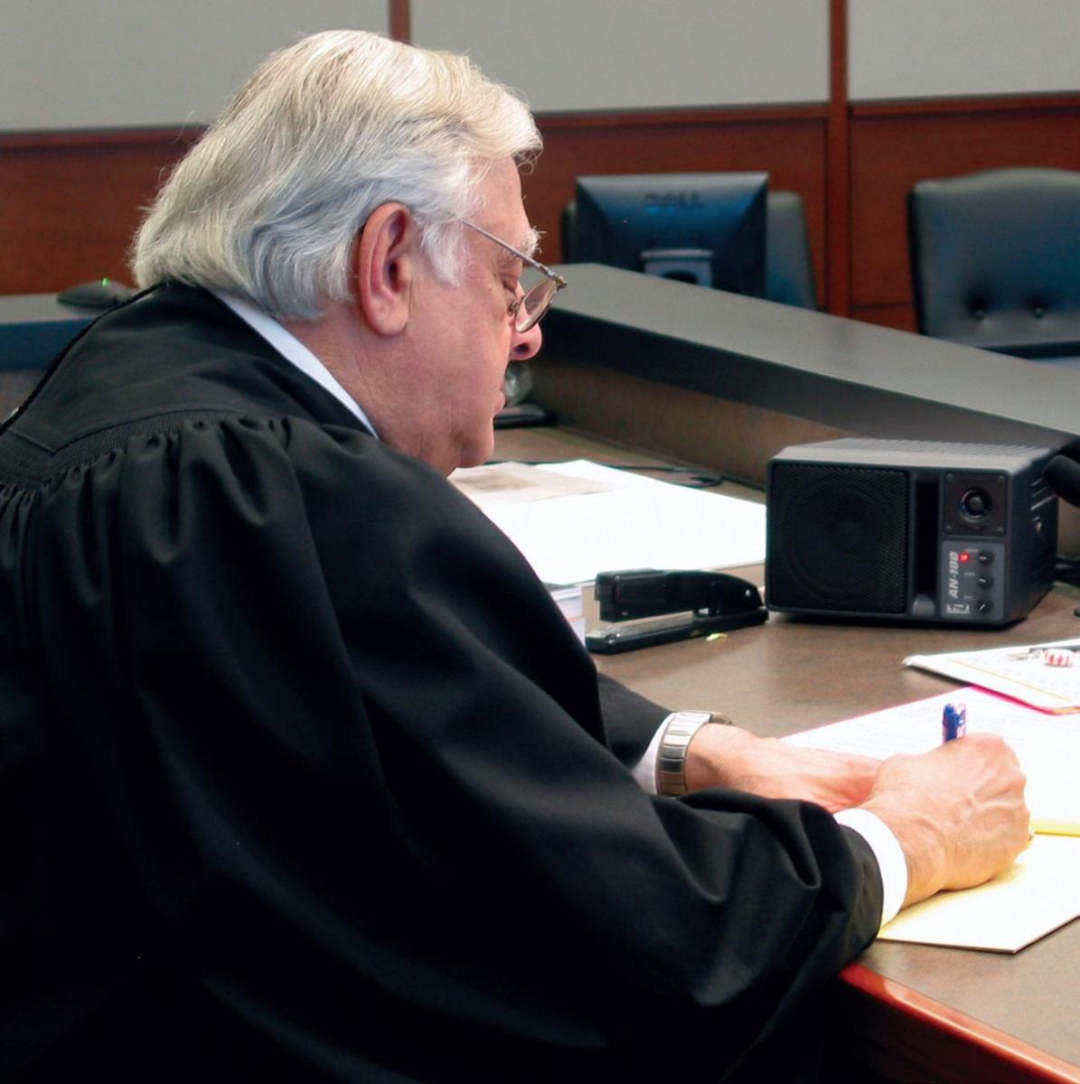 A judge reviews case facts.