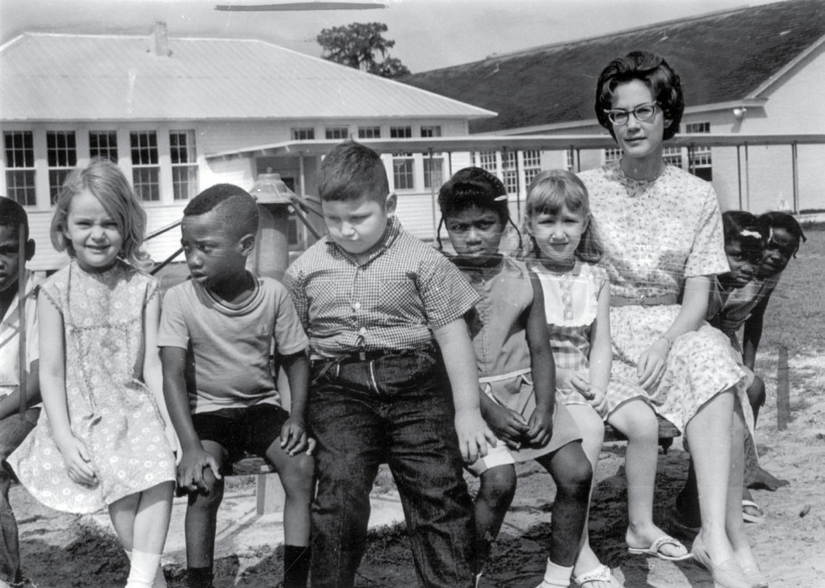 A class of desegregated students and their teacher
