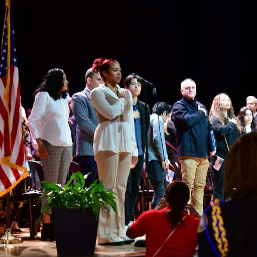 Lyric Hall, Riverside High School Senior, leads the Pledge of Allegiance.