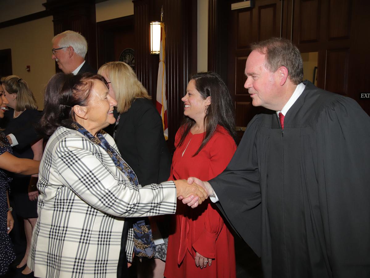 Judge Corrigan congratulating a new United States citizen with judges of the Fourth Judicial Circuit of Florida. Judge Corrigan congratulating a new United States citizen with judges of the Fourth Judicial Circuit of Florida.