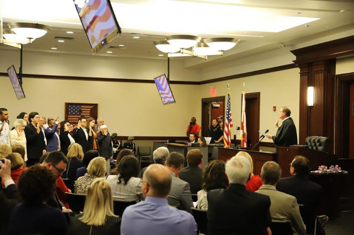 Judge Corrigan administers the Oath of Allegiance to the United States of America in the Duval County Courthouse to 50 new citizens from 27 countries. Judge Corrigan administers the Oath of Allegiance to the United States of America in the Duval County Courthouse to 50 new citizens from 27 countries.