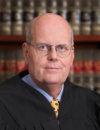 A headshot photo of United States Magistrate Judge Thomas B. Smith